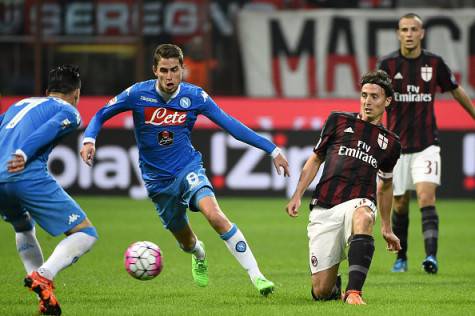 AC Milan's midfielder Riccardo Montolivo (R) vies for the ball with Napoli's Brazilian midfielder Jorginho (C) during the Italian Serie A football match between AC Milan and Napoli at San Siro Stadium in Milan on October 4,  2015. AFP PHOTO / OLIVIER MORIN        (Photo credit should read OLIVIER MORIN/AFP/Getty Images)