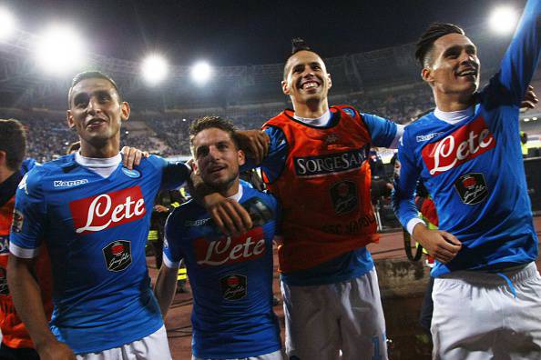 (From L) Napoli's players : Algerian defender Faouzi Ghoulam, Belgian forward Dries Mertens, Slovak forward Marek Hamsik and Spanish forward Jose Maria Callejon celebrate at the end of the Italian Serie A football match SSC Napoli vs FC Juventus on September 26, 2015 at the San Paolo stadium in Naples. AFP PHOTO / CARLO HERMANN        (Photo credit should read CARLO HERMANN/AFP/Getty Images)