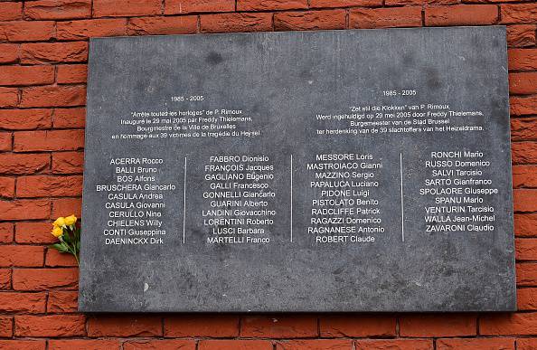 A flower adorns a plaque bearing the names of the victims of the Heysel Stadium tragedy during a ceremony marking the 30th anniversary of the tragedy at the stadium, renamed King Baudouin Stadium, in Brussels, on May 29, 2015. On 29 May 1985 in Brussels, 39 football fans died and 600 were injured just before the Juventus Liverpool European Cup Final. Violence among supporters led to the collapse of a wall in the old and ill-equipped Heysel Stadium. AFP PHOTO / EMMANUEL DUNAND        (Photo credit should read EMMANUEL DUNAND/AFP/Getty Images)