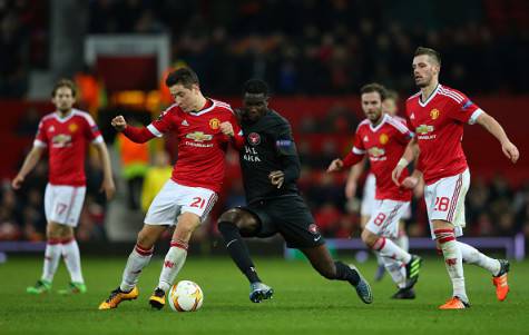 MANCHESTER, ENGLAND - FEBRUARY 25: Ander Herrera of Manchester United and Paul Onuachu of FC Midtjylland compete for the ball during the UEFA Europa League Round of 32 second leg match between Manchester United and FC Midtjylland at Old Trafford on February 25, 2016 in Manchester, United Kingdom. (Photo by Alex Livesey/Getty Images)